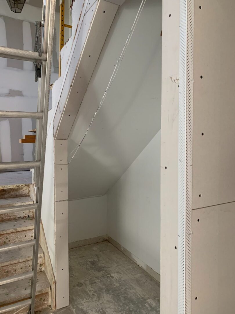 A stairway is being built in a house.
